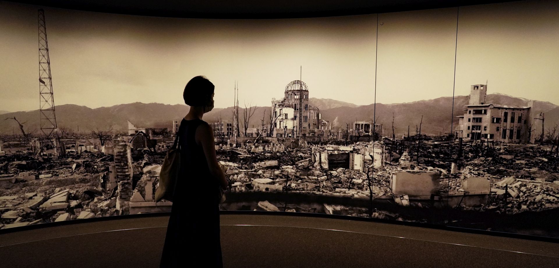 epa08584665 A visitor looks at photographs of the Hiroshima bombing aftermath, at the Hiroshima Peace Memorial Museum in Hiroshima, Japan, 05 August 2020. On 06 August 2020 Japan will mark the 75th anniversary of the bombing of Hiroshima. In 1945 the United States dropped two nuclear bombs over the cities of Hiroshima and Nagasaki on 06 and 09 August respectively, killing more than 200,000 people. This year’s annual commemoration events were either canceled or scaled down amid the ongoing coronavirus pandemic.  EPA/DAI KUROKAWA