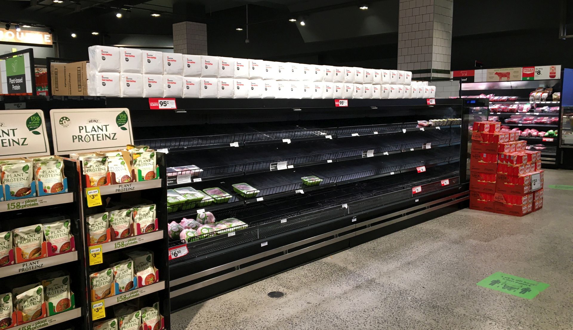 epa08584652 Empty shelves in a poultry section of a Woolworths supermarket in Melbourne, Australia, 05 August 2020. Shortages of meat products is occurring throughout supermarkets after a spike in coronavirus infections in the meat processing industry and an increase in panic buying after a stage four lockdown was announced.  EPA/JAMES ROSS AUSTRALIA AND NEW ZEALAND OUT