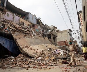 epa08596707 View of a collapsed building in Amritsar, India, 11 August 2020. No casualties were reported after the roof of a four-storey building of an embroidery factory collapsed on the night of 10 August.  EPA/RAMINDER PAL SINGH