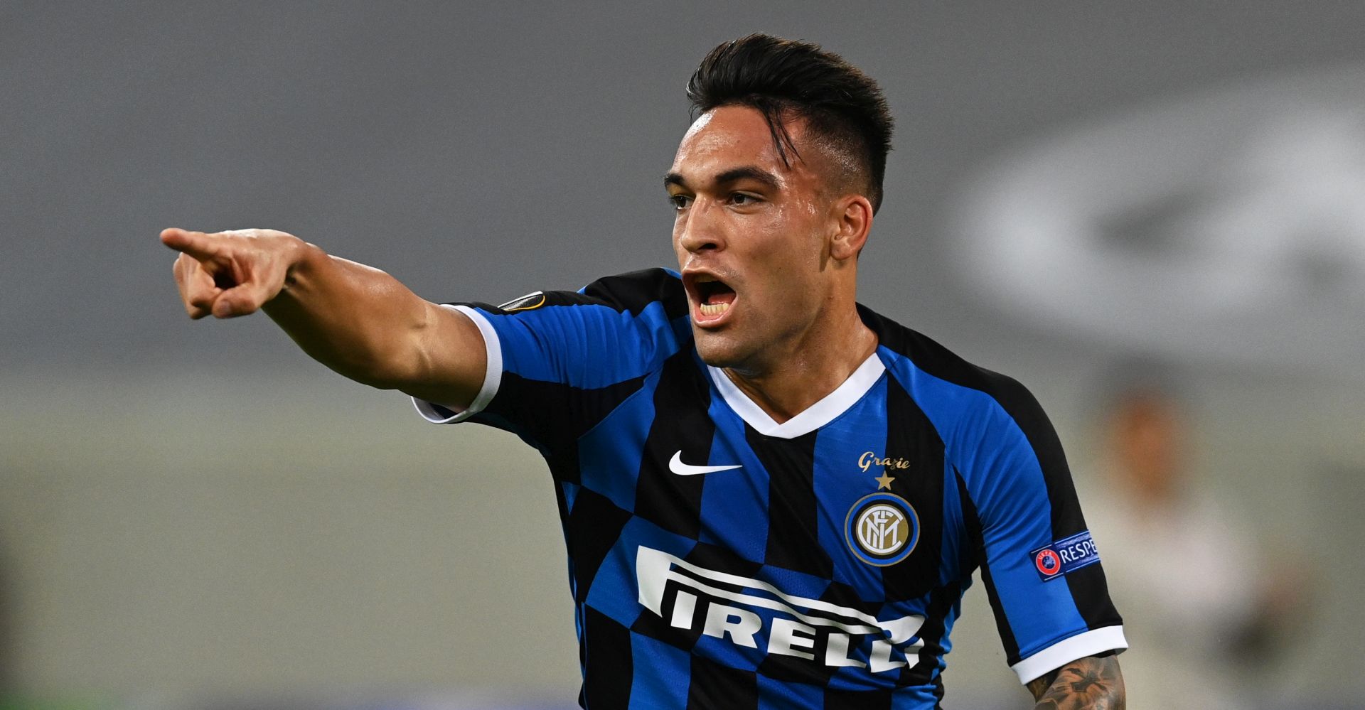 epa08609579 Lautaro Martinez of Inter celebrates after scoring the 1-0 lead during the UEFA Europa League semi final match between Inter Milan and Shakhtar Donetsk in Duesseldorf, Germany, 17 August 2020.  EPA/Sascha Steinbach / POOL