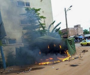 epa08611404 A roadside stall burns following looting after Mali military entered the streets of Bamako, Mali 18 August 2020. Local reports indicate Mali military have seized Mali President Ibrahim Boubakar Keïta in what appears to be a coup attempt.  EPA/STR