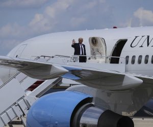 epa08615123 US President Donald J. Trump waves as he boards Air Force One at Andrews Air Force Base, Maryland, USA, on 20 August 2020. Trump travels to Old Forge, PA, to deliver remarks at Mariotti Building Products.  EPA/Oliver Contreras / POOL