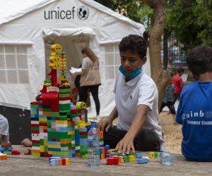 epa08616547 Children play during activities organized by charities and civil society groups working under the auspices of the UNICEF for Lebanese and Syrian children who were affected by the explosion in the Beirut port, in Beirut, Lebanon, 21 August 2020. Volunteers provide different activities as well as meals for children affected by the explosion. Lebanese Ministry of Health said at least 179 people were killed and more than 6,000 others injured, as well as 49 missing persons in the explosion on 04 August that also damaged 50 thousand housing units, and left 300 thousand people homeless.  EPA/Nabil Mounzer