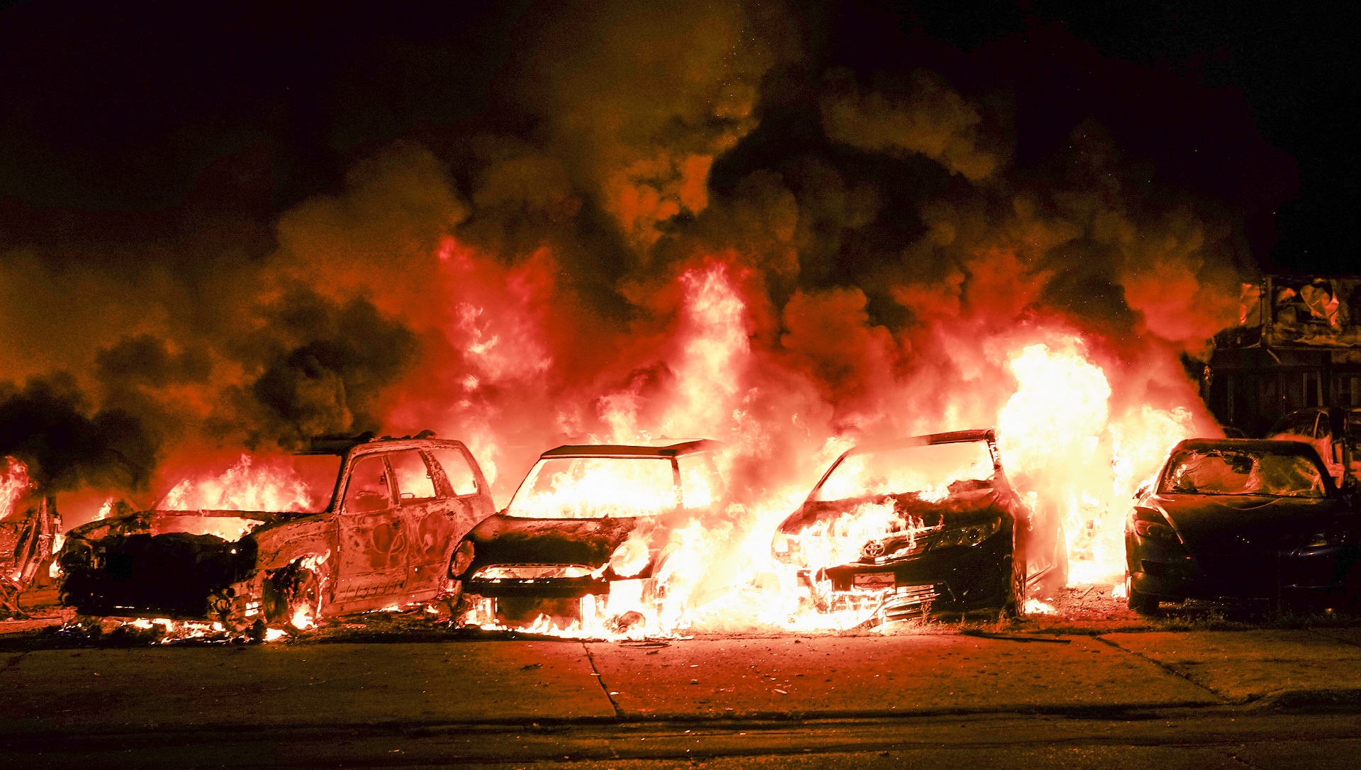 epa08623796 Automobiles burn after being set ablaze during a second night of unrest in the wake of the shooting of Jacob Blake by police officers, in Kenosha, Wisconsin, USA, 24 August 2020. According to media reports Jacob Blake, a black man, was shot by a Kenosha police officer or officers responding to a domestic distubance call on 23 August, setting off protests and unrest. Blake was taken by air ambulance to a Milwaukee, Wisconsin hospital and protests started after a video of the incident was posted on social media.  EPA/TANNEN MAURY