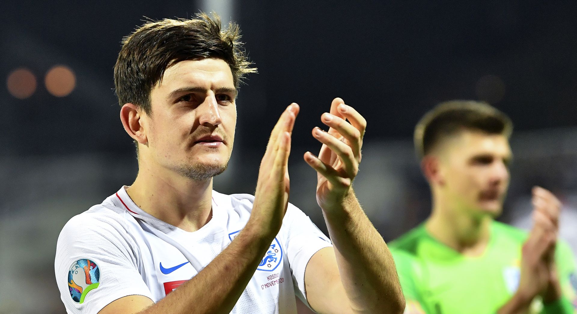 epa08624563 (FILE) - England's Harry Maguire applauds supporters after the UEFA EURO 2020 group A qualifying soccer match between Kosovo and England in Pristina, Kosovo, 17 November 2019 (reissued 02 August 2020). England manager Southgate on 25 August 2020 confirmed the Manchester Unted captain Maguire will be part of the national squad for the September 2020 Nations Leage matches. The world's most expensive defender's nomination for the squad comes within a week after being arrested on late 20 August on the Greek island of Mykonos for allgedely attacking police outside a bar.  EPA/GEORGI LICOVSKI *** Local Caption *** 55640426