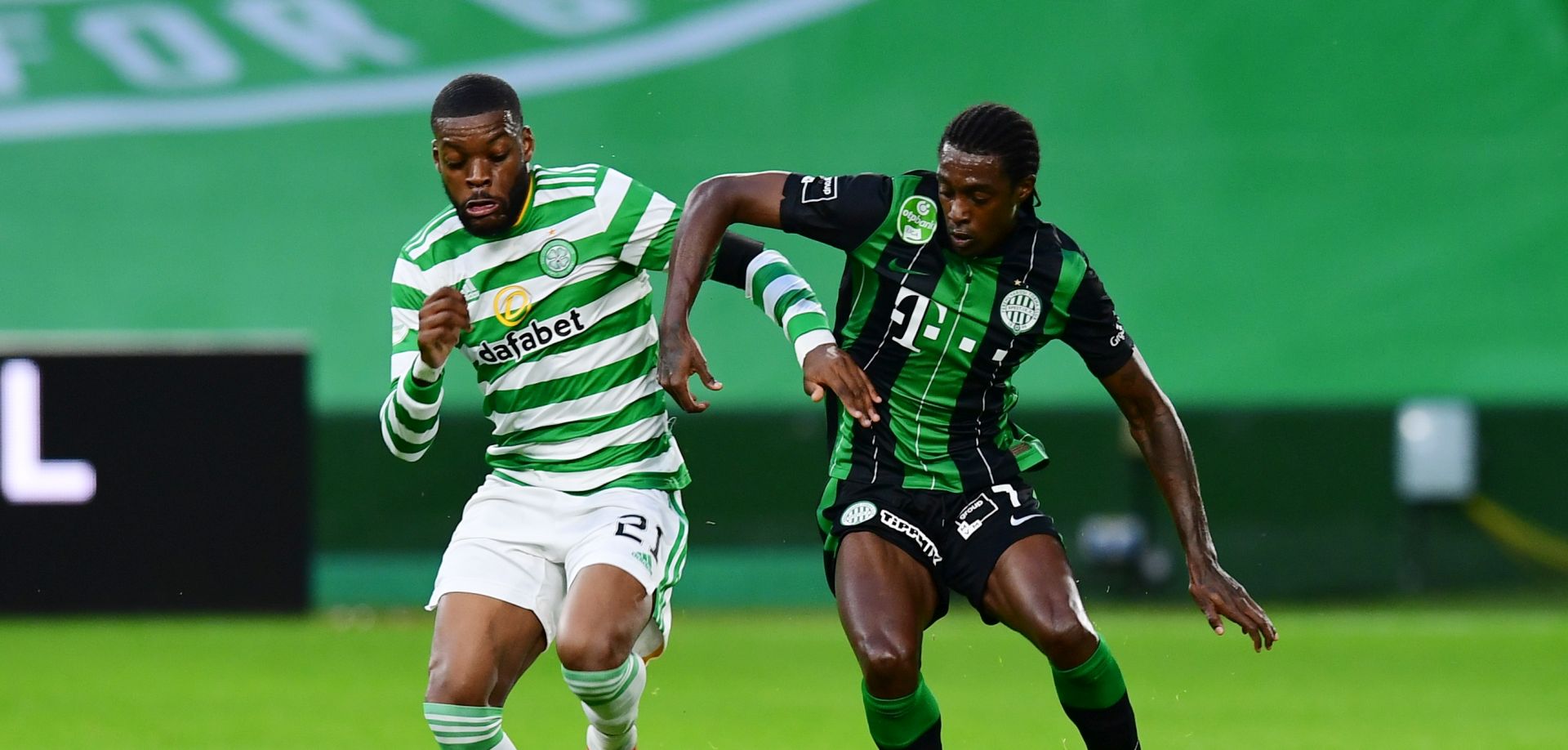 epa08627442 Olivier Ntcham of Celtic (L) in action against Wergiton do Rosario Calmon of Ferencvaros (R) during the UEFA Champions League second qualifying round match between Celtic Glasgow and Ferencvaros TC in Glasgow, Britain, 26 August 2020.  EPA/Mark Runnacles / POOL