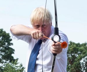 Britain's PM Johnson visits Premier Education Summer Camp at Sacred Heart of Mary Girls' in Upminster Britain's Prime Minister Boris Johnson takes part in an archery session as he visits Premier Education Summer Camp at Sacred Heart of Mary Girls', as the coronavirus disease (COVID-19) outbreak continues, in Upminster, London, Britain August 10, 2020. Lucy Young/Pool via REUTERS     TPX IMAGES OF THE DAY POOL