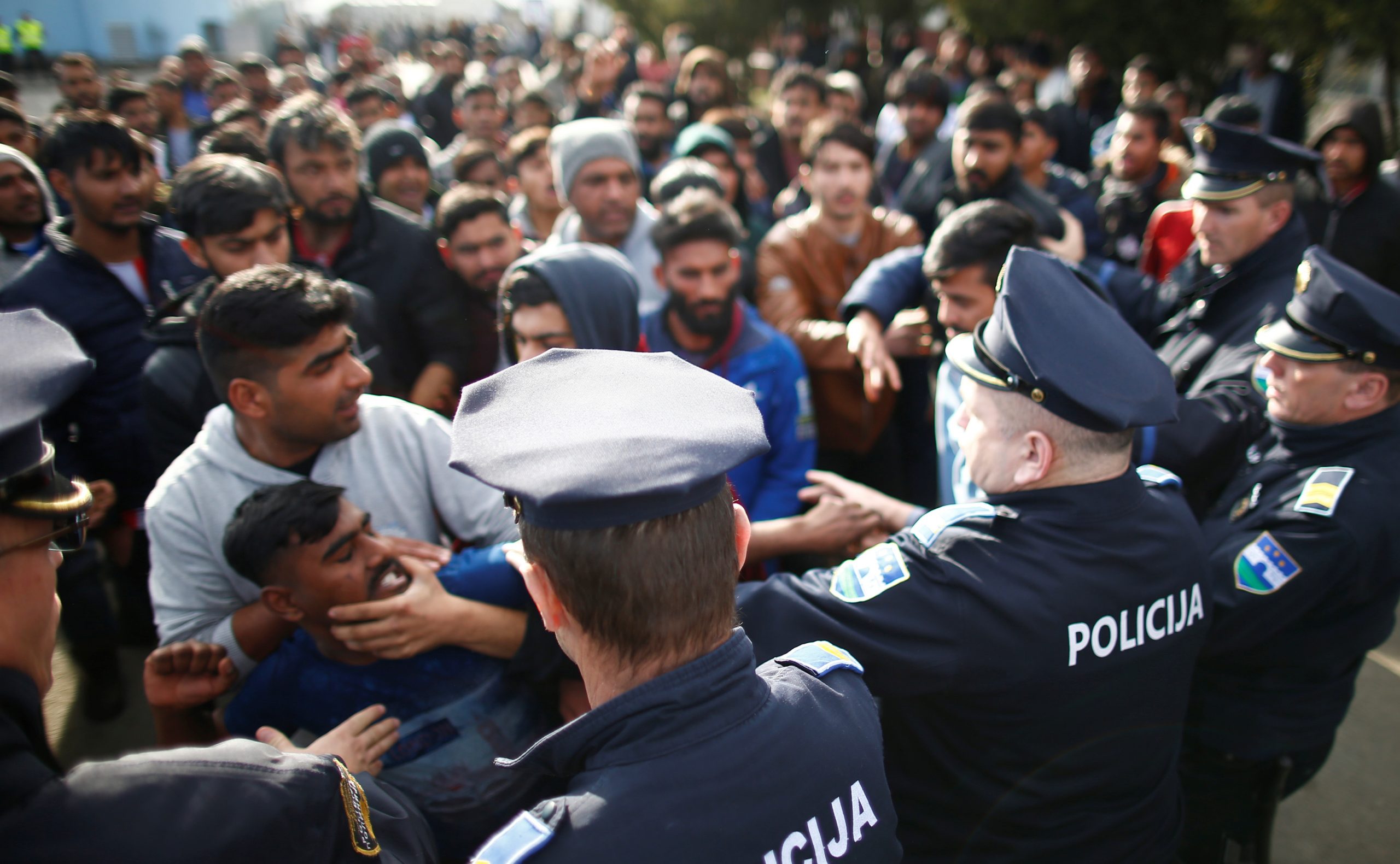 Migrants scuffle with police as they try to block a road in front of the refugee camp Miral in Velika Kladusa Migrants scuffle with police as they try to block a road in front of the refugee camp Miral in Velika Kladusa, Bosnia and Herzegovina February 15, 2020. REUTERS/Dado Ruvic DADO RUVIC