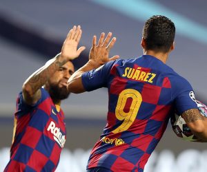 epa08604349 Luis Suarez (R) of Barcelona celebrates with Arturo Vidal of Barcelona after scoring the second goal for his team during the UEFA Champions League quarter final match between Barcelona and Bayern Munich in Lisbon, Portugal, 14 August 2020.  EPA/Rafael Marchante / POOL
