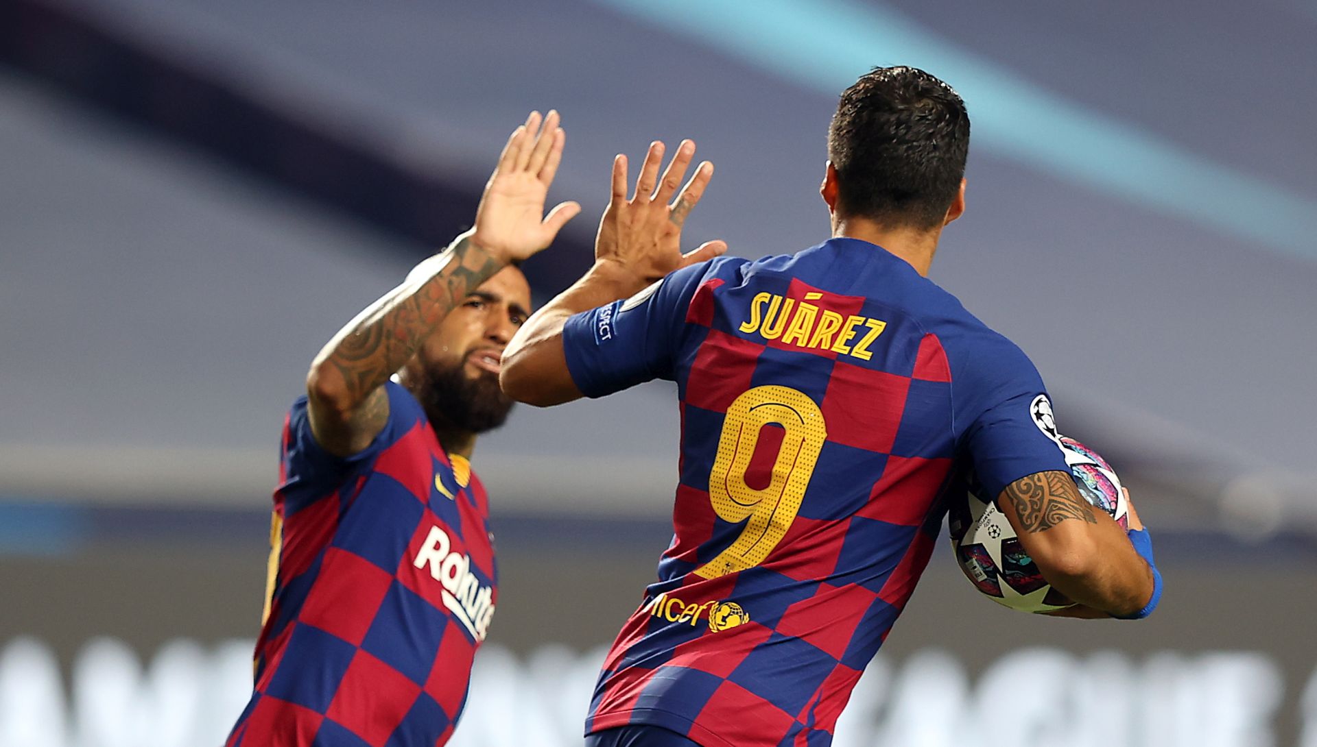 epa08604349 Luis Suarez (R) of Barcelona celebrates with Arturo Vidal of Barcelona after scoring the second goal for his team during the UEFA Champions League quarter final match between Barcelona and Bayern Munich in Lisbon, Portugal, 14 August 2020.  EPA/Rafael Marchante / POOL