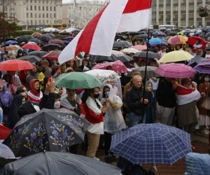 epa08624823 Belarus opposition activists attend under rain a protest rally against the results of the presidential elections, in Minsk, Belarus 25 August 2020. Opposition in Belarus alleges poll-rigging and police violence at protests following election results claiming that president Lukashenko had won a landslide victory in the 09 August elections.  EPA/TATYANA ZENKOVICH