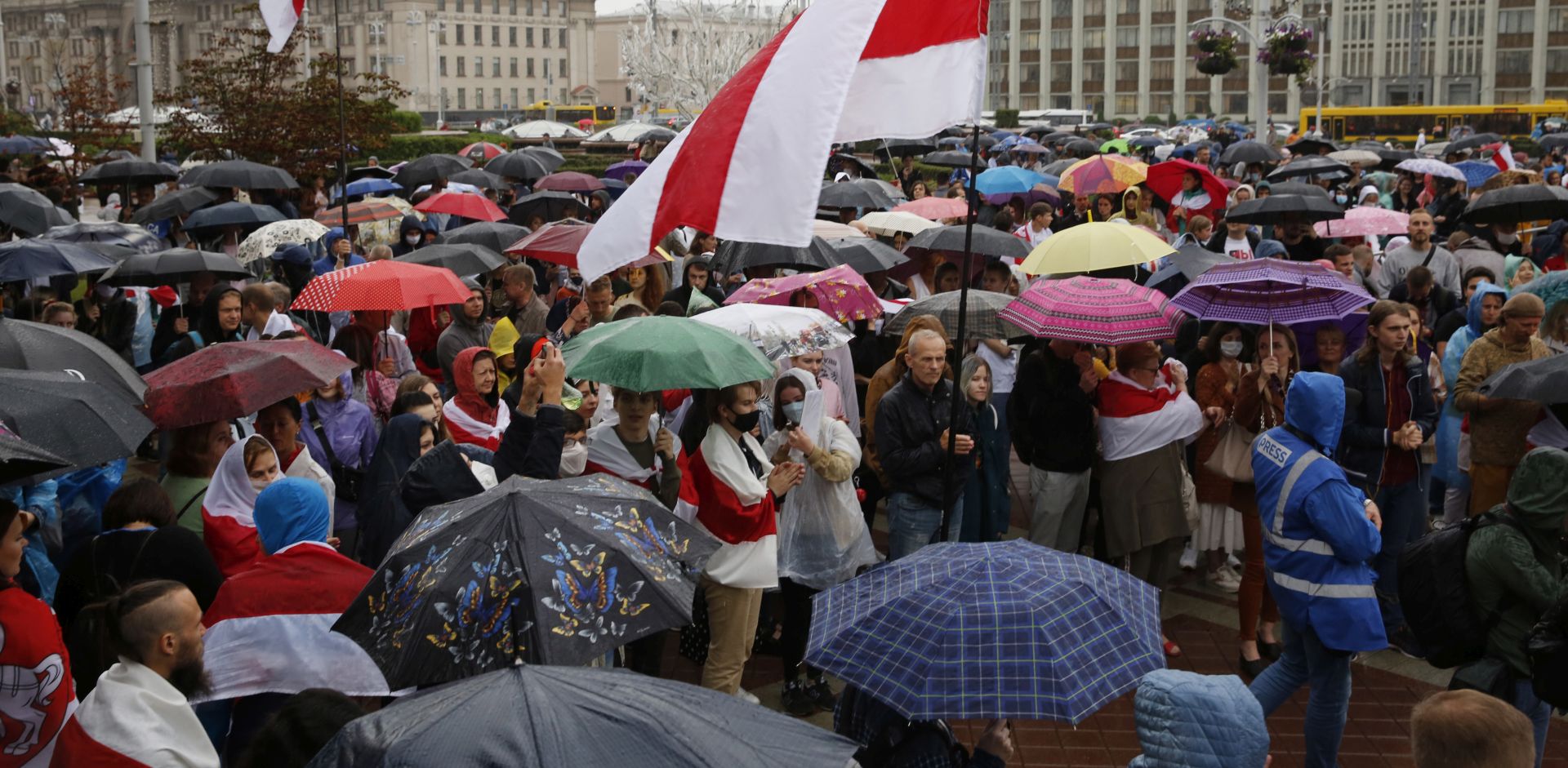 epa08624823 Belarus opposition activists attend under rain a protest rally against the results of the presidential elections, in Minsk, Belarus 25 August 2020. Opposition in Belarus alleges poll-rigging and police violence at protests following election results claiming that president Lukashenko had won a landslide victory in the 09 August elections.  EPA/TATYANA ZENKOVICH