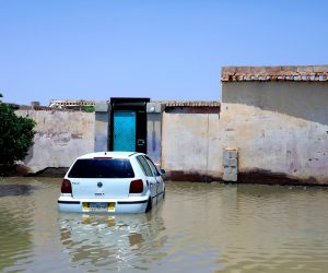 epa08633606 A car is submerged in flood water of the Nile River at al-Kalakla area, south of Khartoum, Sudan, 29 August 2020. According to media reports, at least 86 people reportedly died due to record flood level of the Nile River that also damaged thousands of houses.  EPA/MOHAMMED ABU OBAID
