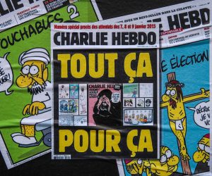 epa08640715 The cover of the French satirical weekly Charlie Hebdo with the controversial cartoons of Prophet Muhammad published in 2012, got sticked on a wall next to the former office of Charlie Hebdo, in Paris, France, 02 September 2020. The Charlie Hebdo terror attack trial will be held from 02 September to 10 November 2020. The Charlie Hebdo terrorist attacks in Paris happened on 07 January 2015, with the storming of armed Islamist extremists of the satirical newspaper, starting three days of terror in the French capital.  EPA/Mohammed Badra