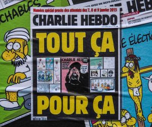 epa08640715 The cover of the French satirical weekly Charlie Hebdo with the controversial cartoons of Prophet Muhammad published in 2012, got sticked on a wall next to the former office of Charlie Hebdo, in Paris, France, 02 September 2020. The Charlie Hebdo terror attack trial will be held from 02 September to 10 November 2020. The Charlie Hebdo terrorist attacks in Paris happened on 07 January 2015, with the storming of armed Islamist extremists of the satirical newspaper, starting three days of terror in the French capital.  EPA/Mohammed Badra