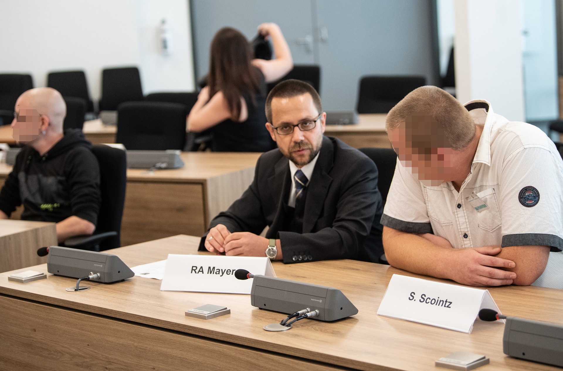 epa08652036 Defendant Sebastian S. (R) and his lawyer (C) in a courtroom of the Higher Regional court before the start of a trial of the so-called Freital group two, in Dresden, Germany, 07 September 2020. Group Freital two is a far-right terrorist group from Freital near Dresden. The defendants are accused of membership in a terrorist organization.  EPA/STR / POOL ATTENTION EDITORS: FACE PIXELATED IN ACCORDANCE WITH GERMAN LAW