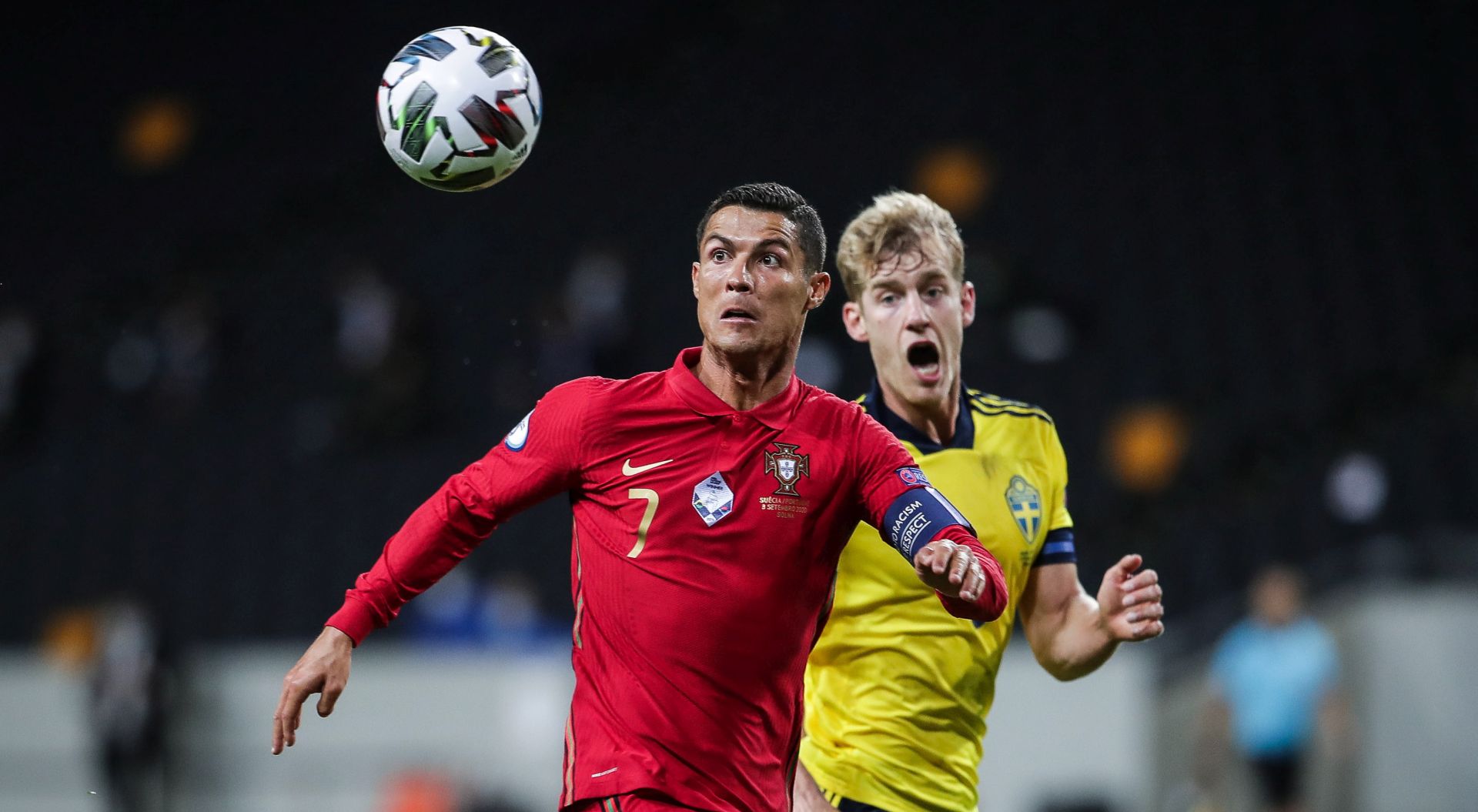 epa08655186 Sweden's Filip Helander (R) in action against Portugal's Cristiano Ronaldo during the UEFA Nations League match at Friends Arena, in Stockholm, Sweden, 08 September 2020.  EPA/MARIO CRUZ