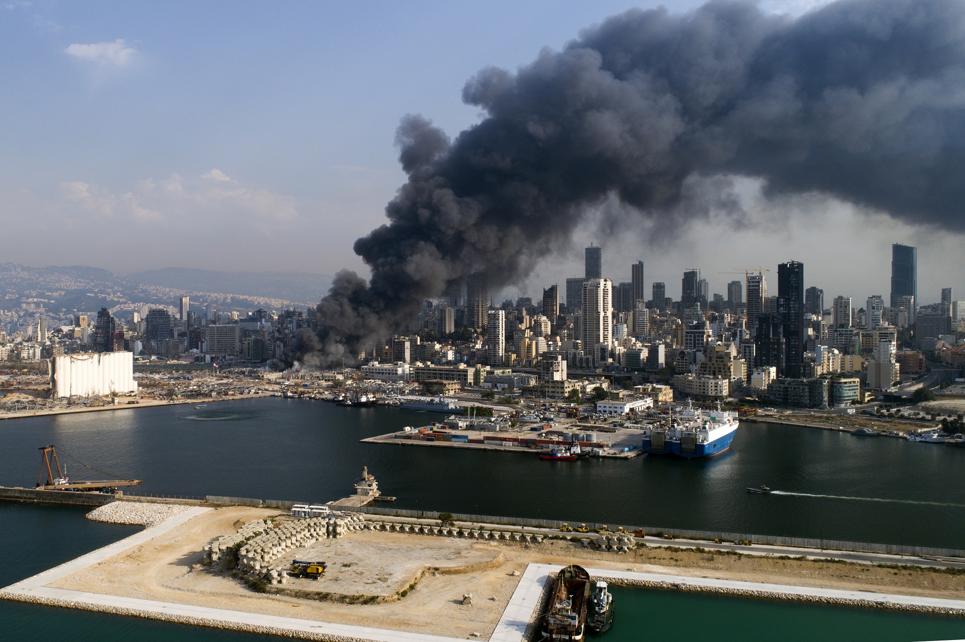 epa08659108 A picture taken with a drone shows thick smoke billows over Beirut after a fresh blaze broke out in Beirut's port in Beirut, Lebanon, 10 September 2020. A Lebanese military source said to local media that the fire broke out on 10 September in an oils and tires warehouse in the port's duty-free zone. The cause of the fire is still yet to be known.  EPA/WAEL HAMZEH
