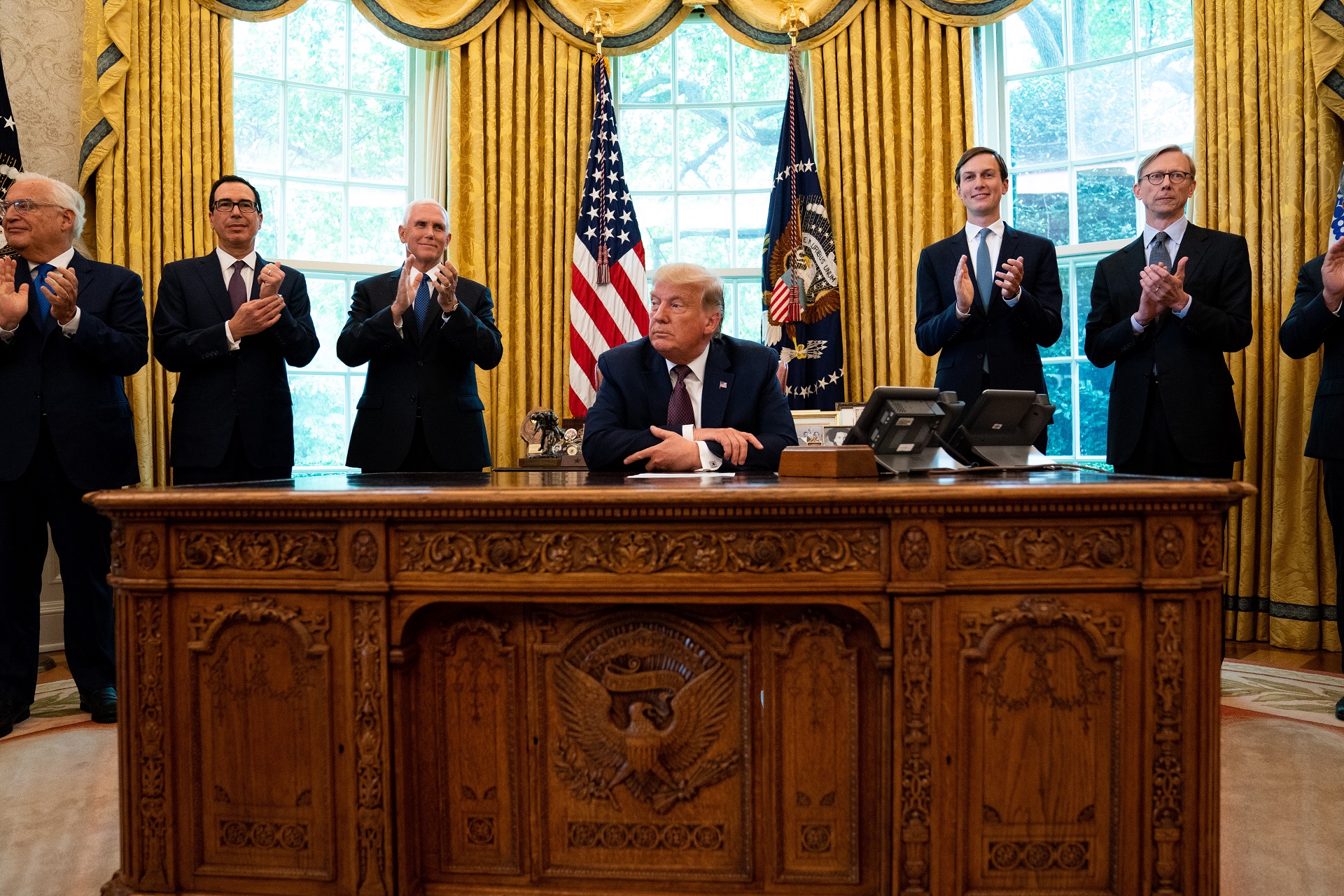 epa08662333 Cabinet members and Foreign Service Officers applaud after US President Donald J. Trump's (C) announcement that Bahrain would normalize relations with Israel, in the Oval Office at the White House in Washington DC, USA, on 11 September 2020.  EPA/Anna Moneymaker / POOL