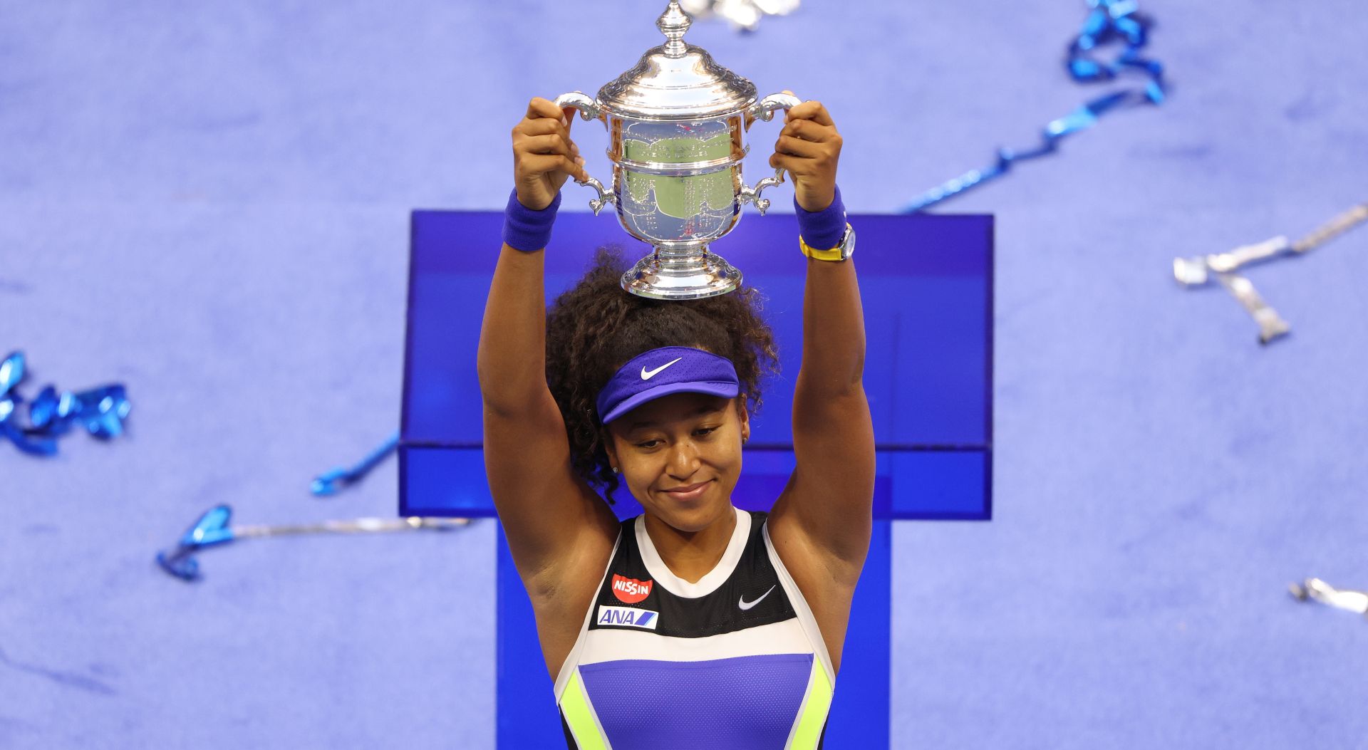 epaselect epa08665467 Naomi Osaka of Japan celebrates with the Championship Trophy after defeating Victoria Azarenka to win the Women's Final match on the thirteenth day of the US Open Tennis Championships the USTA National Tennis Center in Flushing Meadows, New York, USA, 12 September 2020. Due to the coronavirus pandemic, the US Open is being played without fans and runs from 31 August through 13 September.  EPA/JUSTIN LANE