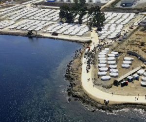 epa08679161 An image taken with a drone shows an aerial view of the new temporary camp near Kara Tepe on Lesbos island, Greece, 18 September 2020. Another 2,000 refugees and migrants were settled into the new temporary hosting facility at Kara Tepe today, while a total of 7,000 have now been installed there since the first day of its operation. A total of 174 coronavirus cases were detected during checks conducted before the asylum seekers' entrance to the facility. All have been placed in isolation in a specially created area at Kara Tepe.  EPA/VANGELIS PAPANTONIS