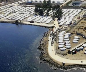 epa08679161 An image taken with a drone shows an aerial view of the new temporary camp near Kara Tepe on Lesbos island, Greece, 18 September 2020. Another 2,000 refugees and migrants were settled into the new temporary hosting facility at Kara Tepe today, while a total of 7,000 have now been installed there since the first day of its operation. A total of 174 coronavirus cases were detected during checks conducted before the asylum seekers' entrance to the facility. All have been placed in isolation in a specially created area at Kara Tepe.  EPA/VANGELIS PAPANTONIS