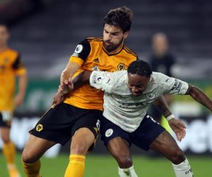 epa08687169 Ruben Neves of Wolverhampton (L) in action against Raheem Sterling of Manchester City during the English Premier League match between Wolverhampton Wanderers and Manchester City in Wolverhampton, Britain, 21 September 2020.  EPA/Nick Potts / POOL EDITORIAL USE ONLY. No use with unauthorized audio, video, data, fixture lists, club/league logos or 'live' services. Online in-match use limited to 120 images, no video emulation. No use in betting, games or single club/league/player publications.