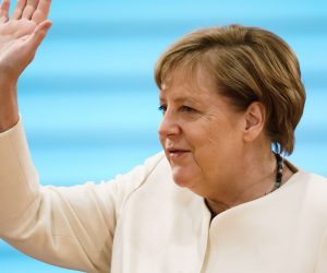 epa08689860 German Chancellor Angela Merkel waves during the beginning of the weekly meeting of the German Federal cabinet in the conference hall of the Chancellery in Berlin, Germany, 23 September 2020. The ministers and the Chancellor are expected to discuss, among others, the budget policy of the Federal Government.  EPA/CLEMENS BILAN / POOL