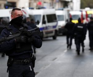 epa08696042 French police and rescue team stand at a security perimeter near the former Charlie Hebdo offices, in Paris, France, 25 September 2020, after four people have been wounded in knife attack. According to recent reports, two assailants are on the run.  EPA/IAN LANGSDON