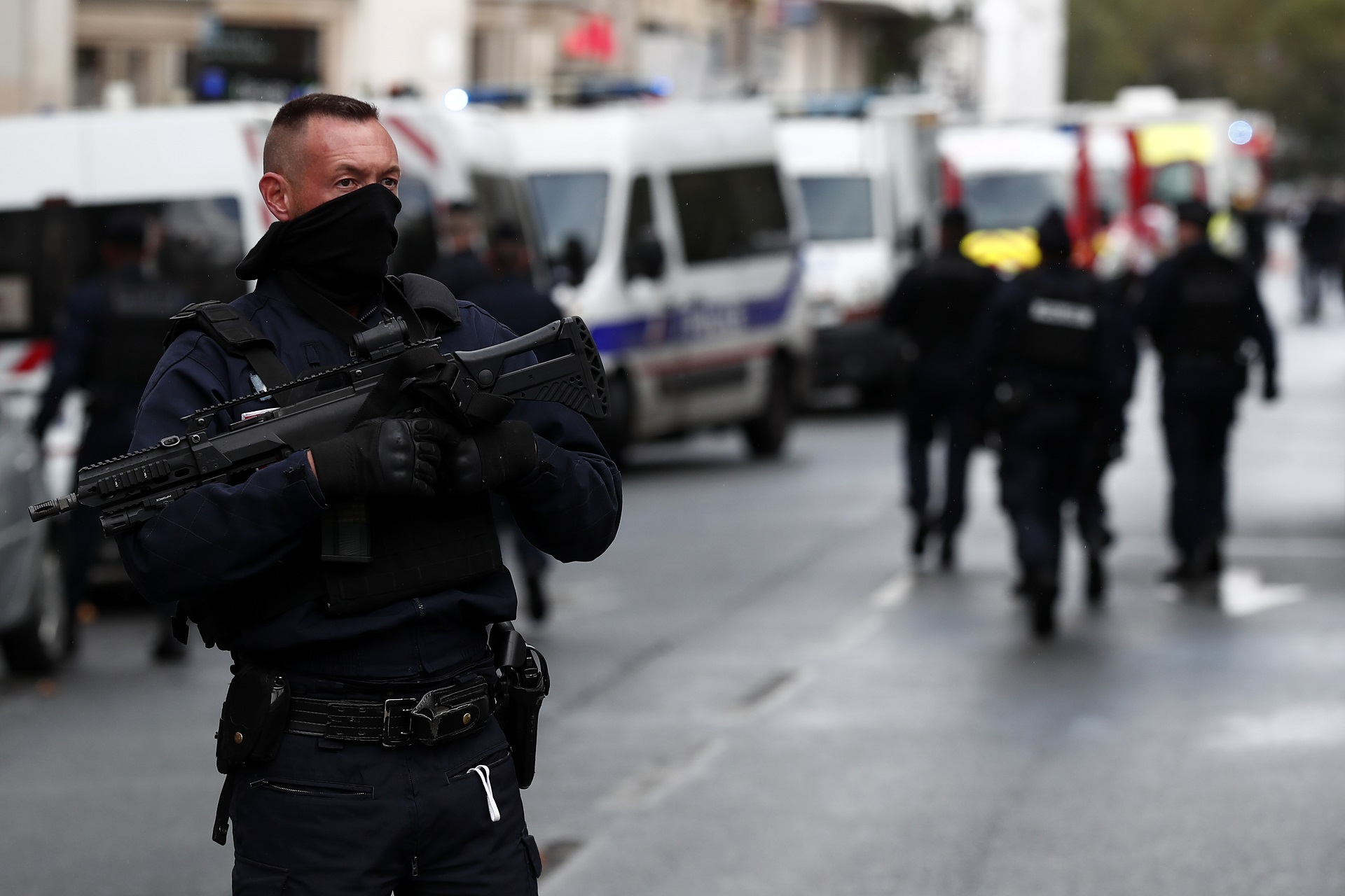 epa08696042 French police and rescue team stand at a security perimeter near the former Charlie Hebdo offices, in Paris, France, 25 September 2020, after four people have been wounded in knife attack. According to recent reports, two assailants are on the run.  EPA/IAN LANGSDON