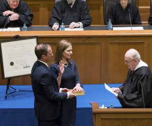 epa08692241 A handout photo provided by the University of Notre Dame Law School shows potential US Supreme Court nominee and current US Court of Appeals for the Seventh Circuit Judge Amy Coney Barrett (2-L) during her investiture as judge for the US Court of Appeals for the Seventh Circuit in the Patrick F. McCartan Courtroom at Notre Dame Law School in South Bend, Indiana, USA, in February 2018 (issued 23 September 2020). US President Donald J. Trump will announce his choice for the replacement for Justice Ruth Bader Ginsburg at the White House in Washington, DC on 26 September 2020. According to media reports Judge Amy Coney Barrett has emerged as US President Trump's favorite.  EPA/UNIVERSITY OF NOTRE DAME LAW SCHOOL / HANDOUT  HANDOUT EDITORIAL USE ONLY/NO SALES