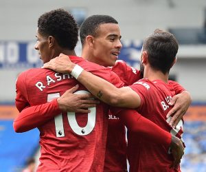 epa08698825 Marcus Rashford (L) of Manchester United celebrates with teammates Mason Greenwood (C) and Bruno Fernandes after scoring during the English Premier League match between Brighton and Manchester United in Brighton, Britain, 26 September 2020.  EPA/Glyn Kirk / POOL EDITORIAL USE ONLY. No use with unauthorized audio, video, data, fixture lists, club/league logos or 'live' services. Online in-match use limited to 120 images, no video emulation. No use in betting, games or single club/league/player publications.
