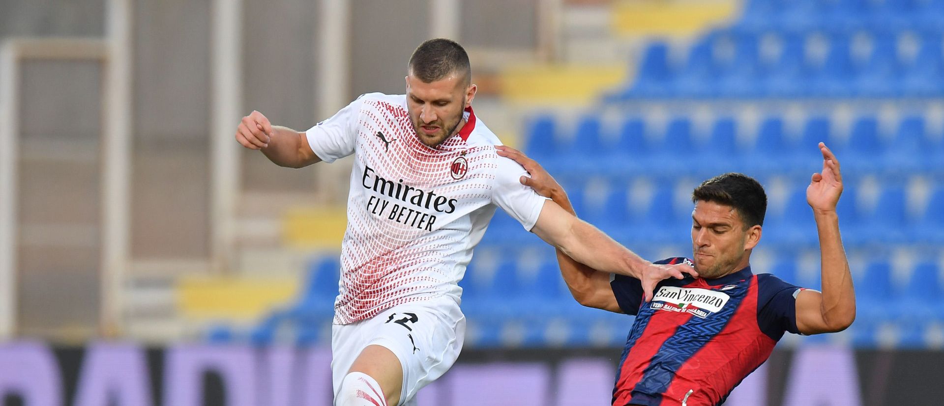 epa08702042 Milan's Ante Rebic is tackled by Crotone's Lisandro Magallan (R) during the Italian Serie A soccer match between FC Crotone and AC Milan at the Ezio Scida stadium in Crotone, Italy, 27 September 2020.  EPA/CARMELO IMBESI