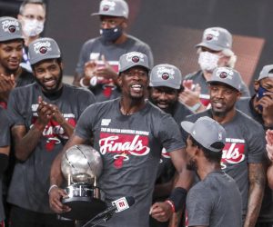 epa08702833 Miami Heat forward Bam Adebayo (C) holds the Eastern Conference Championship trophy as he celebrates with teammates after the NBA basketball Eastern Conference finals playoff game six between the Boston Celtics and the Miami Heat at the ESPN Wide World of Sports Complex in Kissimmee, Florida, USA, 27 September 2020. The Head won the game and will face the Los Angeles Lakers in the NBA Championship Finals.  EPA/ERIK S. LESSER SHUTTERSTOCK OUT