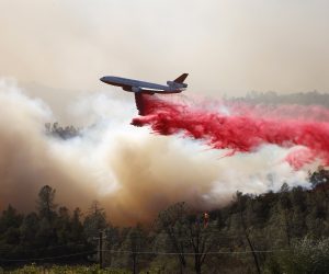epa08702772 An air tanker drops retardant on the Glass Fire in the town of Deer Park in Napa County, California, USA, 27 September 2020. Northern California is under extreme fire alert.  EPA/JOHN G. MABANGLO