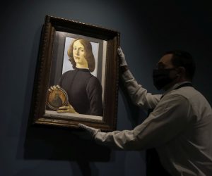 epa08692895 Sandro Botticelli's 15th-century portrait of a 'Young Man Holding a Roundel' is displayed by an employee at Sotheby's Auction house in New York, New York, USA, 23 September 2020 (issued 24 September 2020).The painting is estimated to sell in excess of 80 million US dollars as the main highlight of Sotheby's Masters Week sale. EPA/PETER FOLEY


















estimated to sell in excess of 80 million US dollars as the main highlight of our Masters Week sale  EPA-EFE/Peter Foley