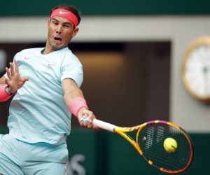 epa08708326 Rafael Nadal of Spain in action against Mackenzie McDonald of the USA during their men’s second round match during the French Open tennis tournament at Roland ​Garros in Paris, France, 30 September 2020.  EPA/YOAN VALAT