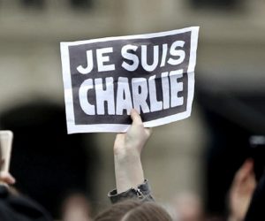 FILE PHOTO: Person holds up a sign during a ceremony at Place de la Republique square to pay tribute to the victims of last year's shooting at the French satirical newspaper Charlie Hebdo, in Paris FILE PHOTO: A person holds up a "Je Suis Charlie" (I am Charlie) sign during a ceremony at Place de la Republique to pay tribute to the victims of last year's shooting at the French satirical newspaper Charlie Hebdo, in Paris, France, January 10, 2016. REUTERS/Yoan Valat/Pool/File Photo POOL New