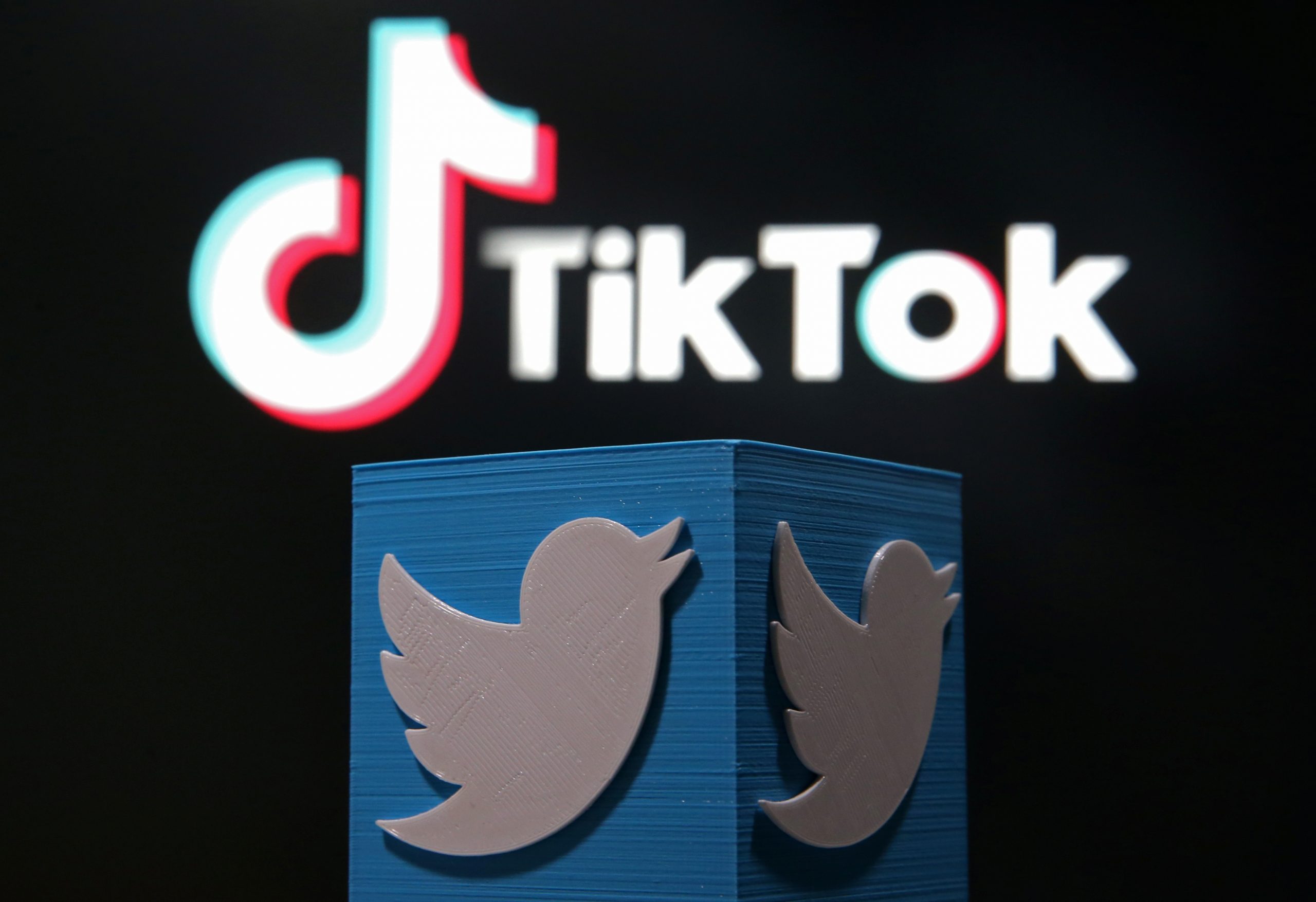 A 3D-printed Twitter logo is placed in front of a displayed Tik Tok logo in this illustration picture A 3D-printed Twitter logo is placed in front of a displayed Tik Tok logo in this illustration picture taken August 9, 2020. REUTERS/Dado Ruvic/Illustration DADO RUVIC