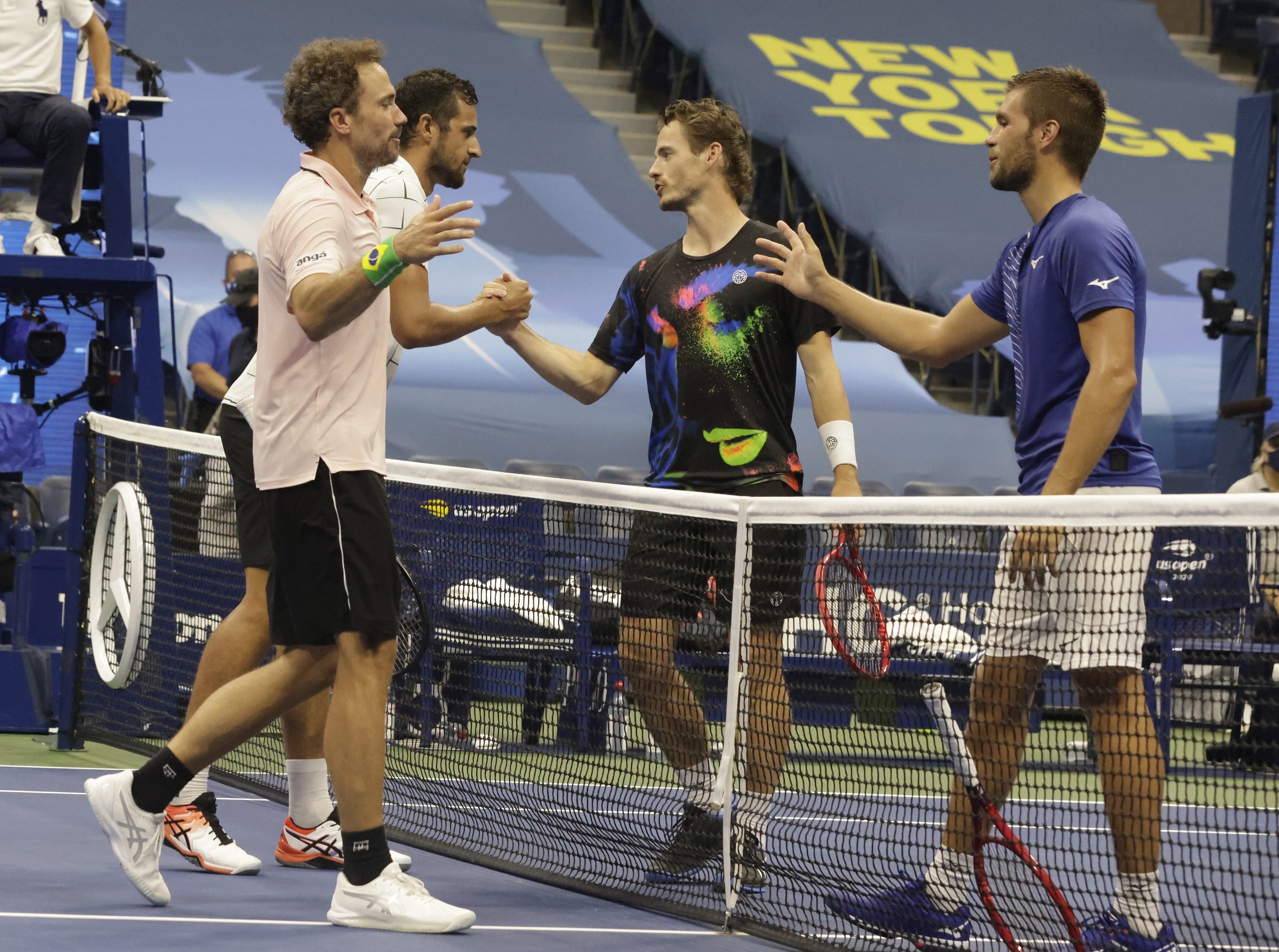 epa08660034 Wesley Koolhof of the Netherlands (2R) and Nikola Mektic of Croatia (R) at the net with Mate Pavic of Croatia (2L) and Bruno Soares of Brazil (L) after the men's doubles final match on the eleventh day of the US Open Tennis Championships the USTA National Tennis Center in Flushing Meadows, New York, USA, 10 September 2020. Due to the coronavirus pandemic, the US Open is being played without fans and runs from 31 August through 13 September.  EPA/JASON SZENES