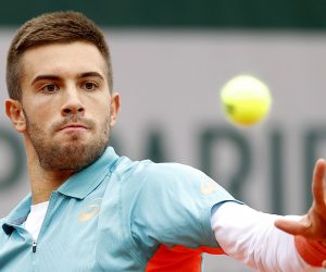 epa08701434 Borna Coric of Croatia in action against Norbert Gombos of Slovakia during their men’s first round match during the French Open tennis tournament at Roland Garros in Paris, France, 27 September 2020.  EPA/IAN LANGSDON