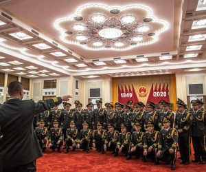 epa08708280 Chinese military orchestra gather for a group photos before performing during the National Day reception in a banquet hall at the Great Hall of the People (GHOP) in Beijing, China, 30 September 2020. China celebrates its National Day on 01 October, marking its 71st founding anniversary.  EPA/ROMAN PILIPEY