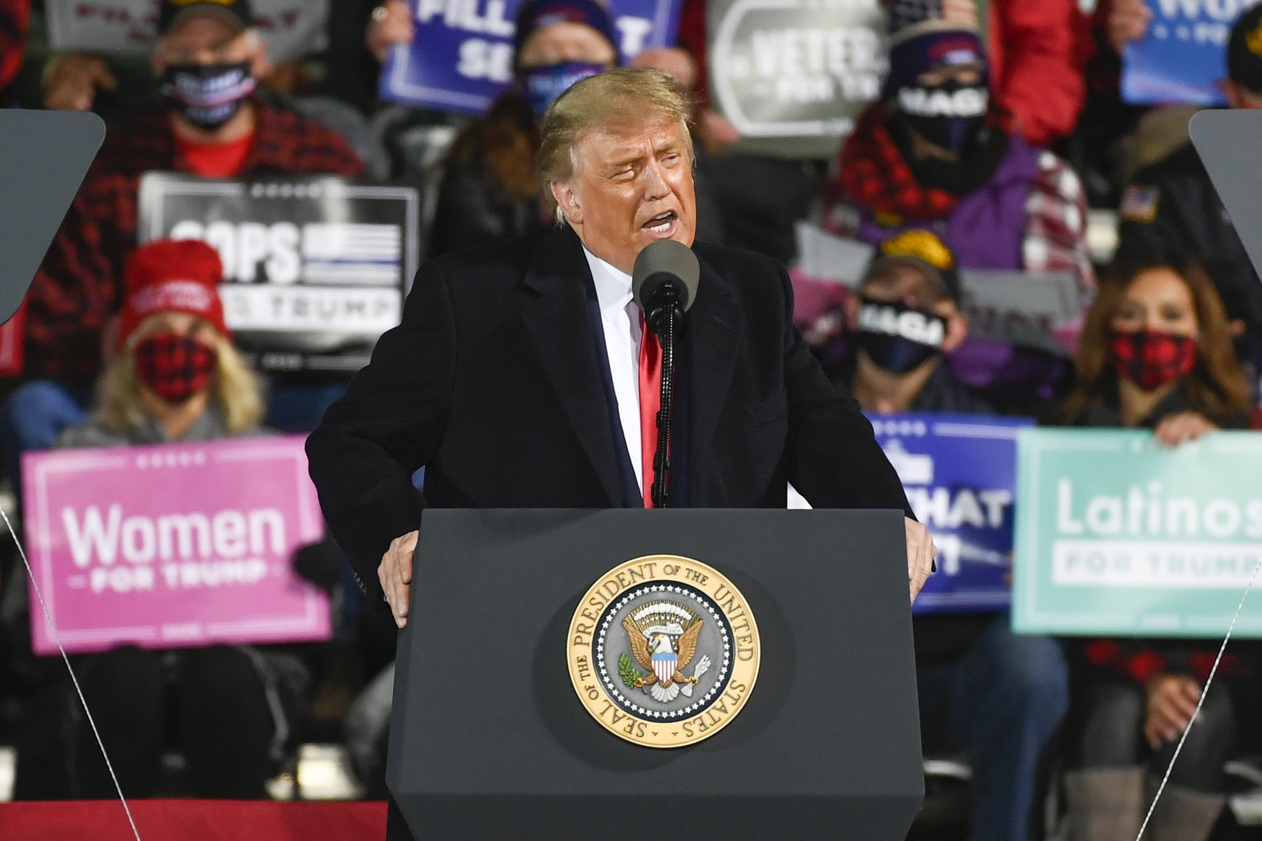 epa08710691 United States President Donald J. Trump speaks during a 'Make America Great Again' election campaign rally at Duluth International Airport in Duluth, Minnesota USA, 30 September 2020. The US presidential elections is slated to be held on 03 November 2020.  EPA/CRAIG LASSIG
