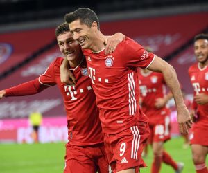 04 October 2020, Bavaria, Munich: Bayern Munich's Robert Lewandowski (R) celebrates scoring his side's third goal with teammate Benjamin Pavard during the German Bundesliga soccer match between Bayern Munich and Hertha Berlin at the Allianz Arena. Photo: Sven Hoppe/dpa - IMPORTANT NOTICE: DFL and DFB regulations prohibit any use of photographs as image sequences and/or quasi-video.