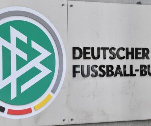 FILED - 03 November 2015, Hessen, Frankfurt/Main: The German Football Federation (DFB) logo can be seen at the headquarter. The DFB headquartersand the homes of DFB officials have been searched on suspicion of tax evasion, Frankfurt prosecutors say. Photo: picture alliance / Boris Roessler/dpa
