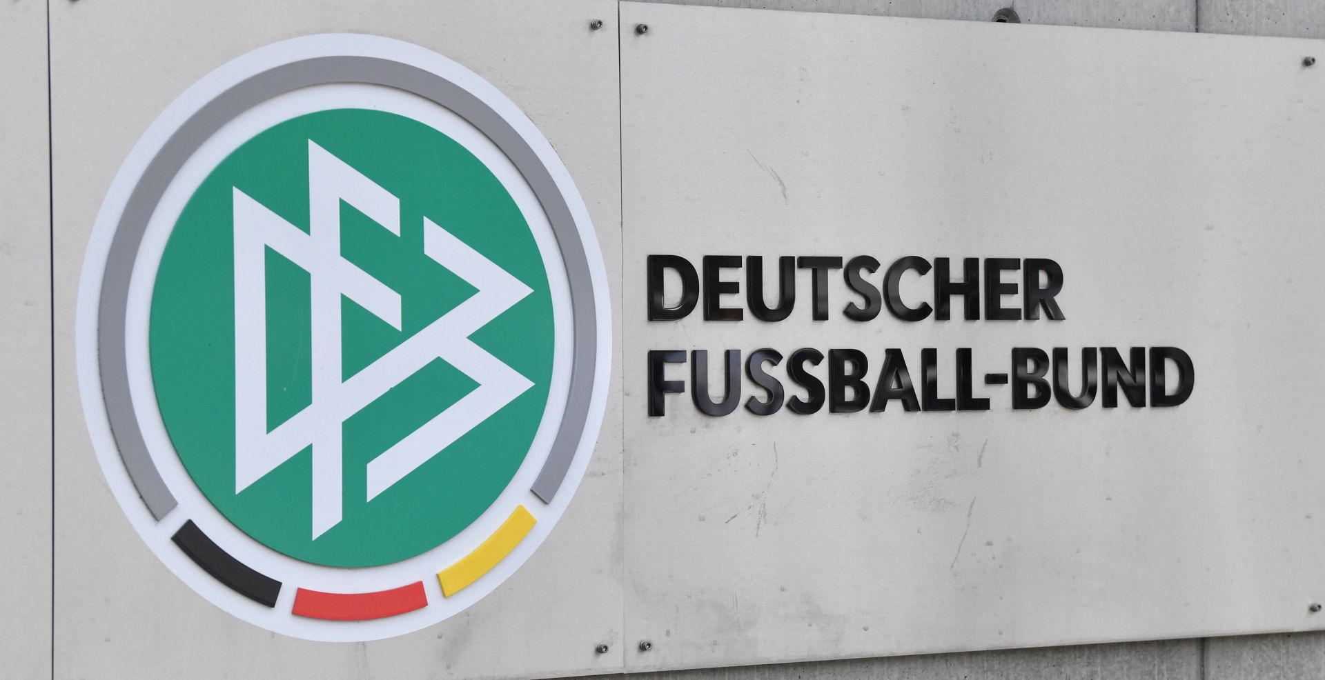 FILED - 03 November 2015, Hessen, Frankfurt/Main: The German Football Federation (DFB) logo can be seen at the headquarter. The DFB headquartersand the homes of DFB officials have been searched on suspicion of tax evasion, Frankfurt prosecutors say. Photo: picture alliance / Boris Roessler/dpa