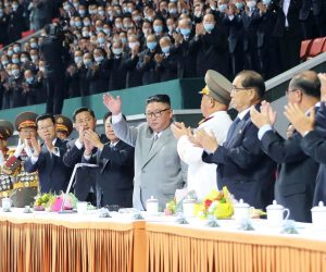 epa08737329 A photo released by the official North Korean Central News Agency (KCNA) shows North Korean leader Kim Jong-un (C) waves during a mass gymnastics and artistic performance at the May Day Stadium during celebrations of the 75th anniversary of the founding of the Workers' Party of Korea (WPK), in Pyongyang, North Korea, 11 October 2020 (issued 12 October 2020).  EPA/KCNA   EDITORIAL USE ONLY