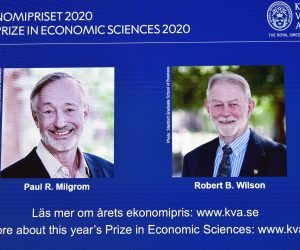 epa08737316 US economists Paul R. Milgrom (L) and Robert B. Wilson (R) receive the Sveriges Riksbank Prize in Economic Sciences in Memory of Alfred Nobel for 2020 presented at a press conference in Stockholm, Sweden, 12 October 2020. Americans Paul Milgrom and Robert Wilson receive the 2020 Nobel Prize in Economic Science for improving auction theory.  EPA/ANDERS WIKLUND SWEDEN OUT