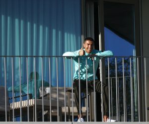 epa08741439 A handout photo made available by Portuguese Football Federation (FPF) shows Portugal national soccer team player Cristiano Ronaldo in the balcony of his room during his team training session for the upcoming UEFA Nations League soccer match with Sweden, Lisbon, Portugal, 13 October 2020. On 13 October 2020 the Portuguese Football Federation announced that Cristiano Ronaldo tested positive for COVID-19 coronavirus. Ronaldo is isolated and asymptomatic.  EPA/DIOGO PINTO / HANDOUT  HANDOUT EDITORIAL USE ONLY/NO SALES