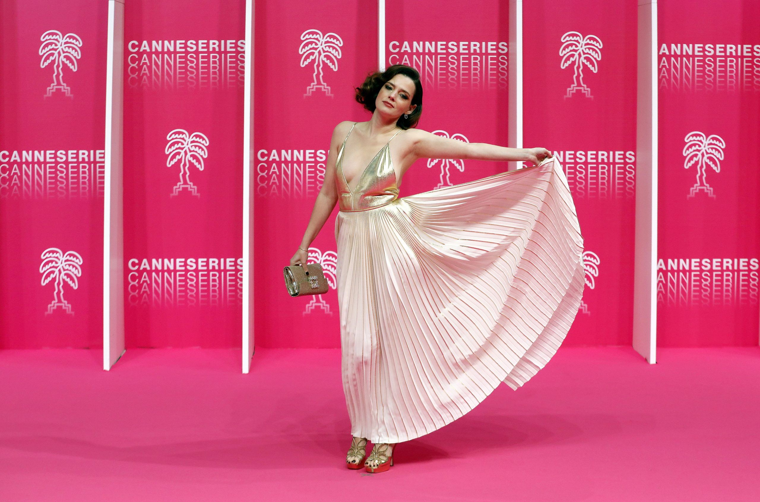 epa08745570 Canneseries jury member French actress Roxane Mesquida poses on the pink carpet before the closing ceremony of the Cannes Series Festival, in Cannes, France, 14 October 2020.  EPA/SEBASTIEN NOGIER